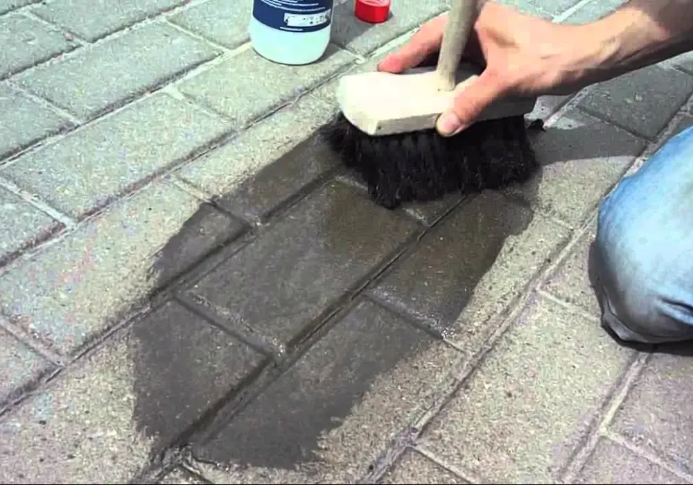 Jak zmyć cement z kostki brukowej - skuteczne metody na plamy