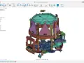 Złożony mechanizm zębatek i elementów, stworzony w programie Autodesk 123d, przypomina skomplikowany zegar lub urządzenie.