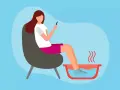 A woman relaxes in a chair, enjoying a soothing foot soak while scrolling on her phone.