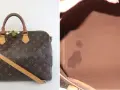 Borsa Louis Vuitton monogram con tracolla e lucchetto. Interno in tela marrone con macchie.