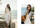 Donna con stile smart casual, indossa gilet, camicia azzurra, pantaloni bianchi ampi e cravatta, con sfondo marino.