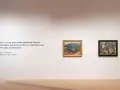 Citazione di Malraux e due dipinti in una sala del museo del Novecento Mestre.