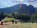 Widok na góry Suchy Wierch i Giewont. Ludzie odpoczywają na szlaku, podziwiając sarnią skałę i jej wysokość.