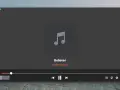 Aplikacja do słuchania muzyki odtwarza "Believer" Imagine Dragons. Widoczny jest pasek postępu i przyciski sterowania.