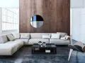 Nowoczesny salon w stylu bauhaus z szarą sofą, drewnianą ścianą i designerskim fotelem.