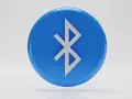 Niebieski okrąg z symbolem Bluetooth. Tak działa bezprzewodowe połączenie między urządzeniami.