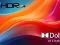 Abstrakte, fließende Formen in leuchtenden Orange-, Rot- und Blautönen. Das HDR10+ und Dolby Vision Logo sind prominent platziert.
