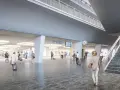Modern, spacious interior of the Lucerne train station with travelers and digital departure boards.