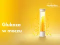 Biały napis "Glukoza w moczu" na żółtym tle. Obok probówka z żółtym płynem i pęcherzykami.