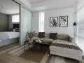 Nowoczesny salon z przesuwnymi drzwiami, za którymi widać sypialnię. Sofa, stoliki, obrazy.