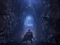 Un guerrero se enfrenta a una estatua en un pasaje oscuro y retorcido, lleno de manos y figuras fantasmales. Un vistazo a Lords of the Fallen, guía para la victoria.