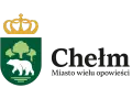 Herb Chełma z koroną i niedźwiedziem, nawiązujący do legendy o Chełmie. Miasto wielu opowieści.