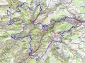 Carte des sentiers de randonnée dans les monts du Cantal, avec des itinéraires GR400 et GR465 traversant des volcans et des villages.
