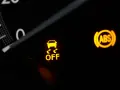 Dashboard lights show the ESC system is OFF, alongside ABS and seatbelt warnings.