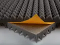Acoustic foam with a peel-and-stick backing, perfect for learning how to soundproof a room.