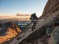 A climber ascends a rocky mountain, proving the obstacle is the path. Sunset paints the sky.