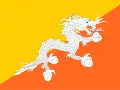 Flaga Bhutan z białym smokiem na tle żółto-pomarańczowym. Smok symbolizuje siłę i czystość.