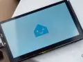 A screen displays the Home Assistant logo, ready for ESPHome Zigbee integration.