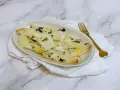 Delizioso merluzzo in friggitrice ad aria, croccante fuori e tenero dentro, guarnito con erbe aromatiche.