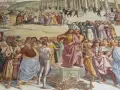 Tłum otacza Jezusa, który przemawia. Wśród tłumu widać ludzi w barwnych strojach, mnichów i żołnierzy. Czy to heretyk, kto to?