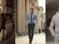Uomo con outfit nero e marrone, completo sartoriale, camicia azzurra e abito grigio chiaro.