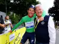 Cyclist in green jersey with Patrick Lefevere, both smiling.