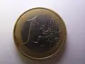 Une pièce de 1 euro 2001, sa valeur est représentée par le chiffre 1 et le mot EURO.