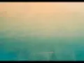 Un dégradé peinture facile, du beige clair au bleu-vert profond, évoquant un ciel au-dessus de l'océan.