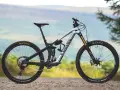 A silver Canyon enduro mountain bike with full suspension, ready to tackle any trail.