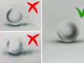 Poprawna kula cieniowania z subtelnym gradientem i cieniem. Dwie poprzednie próby z czerwonymi krzyżykami pokazują nieudane efekty.