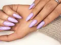 Beautiful lavender acrylic nails, a stylish choice that proves acrylic doesn't have to be expensive.