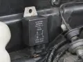 Uszkodzony przekaźnik objawy: czarny element z oznaczeniami G. CARTIER NAGARES, 12V, schematem połączeń i napisem "Made in Spain".