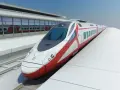 Nowoczesny, biało-czerwony pociąg Pendolino na peronie dworca.