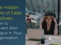 Overwhelmed woman at desk, surrounded by alerts. The image highlights the hidden risks of false positives, showing how they can lead to alert fatigue, impacting true positive detection.