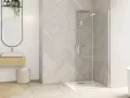 Salle de bain moderne avec douche à l'italienne. Le nettoyage de vitre douche est facilité par le design épuré.
