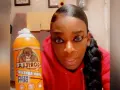 A woman holds a can of Gorilla Glue, wondering if Gorilla Glue works on plastic.