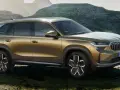 Złoty Skoda Kodiaq na tle górskich krajobrazów. Sprawdź aktualną Skoda Kodiaq cenę i odkryj przygodę!