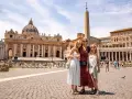 A family poses in St. Peter's Square, Rome, with St. Peter's Basilica in the background. A dream come true, seeing the Pope in Rome!