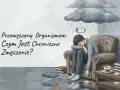 Chłopak siedzi przygnębiony w fotelu pod deszczową chmurą z ikoną rozładowanej baterii. To obraz objawów przemęczenia.