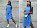 Kobieta w niebieskiej sukience z rozcięciem i białymi sneakersami. Idealne buty do niebieskiej sukienki na co dzień.