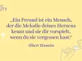 Ein Zitat von Albert Einstein über Freundschaft mit Illustration von zwei Fingern, die sich berühren.