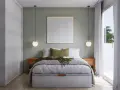 Cama moderna con cuadros decorativos que ponen en vez de cabecero. Mesitas de noche de madera y lámparas colgantes.