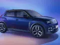 Nowe, granatowe Renault 5 z czarnym dachem i złotymi akcentami, na tle niebiesko-fioletowego gradientu.