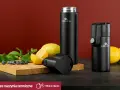 Dwa czarne termosy Gerlach, cytryny, mięta i borówki na desce. Czy termos można myć w zmywarce? Sprawdź!