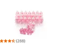 En stor godisask med många små rosa nappflaskor dekorerade med rosetter och små nappar.