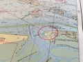 Seekarten-Details zeigen Wangerooge mit Leuchtturm und Schiffshorn-Signalen.