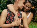 A couple embraces, their faces close, a tender moment that hints at the powerful pull of lust.