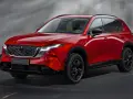 Czerwony Mazda CX-5, jeden z wielu stylowych japońskich samochodów, prezentuje się elegancko na ciemnym tle.