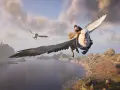 Un estudiante de Hogwarts Legacy vuela en hipogrifo, completando una misión de guardia alta sobre un paisaje costero con ruinas.