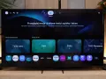 Telewizor z interfejsem Smart Hub. Widoczne aplikacje: TVP1, TVP2, Netflix, Prime Video, Disney+, YouTube.